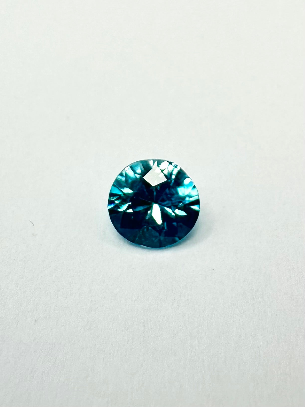 0.97cts 5.52x3.40 Round Teal Blue Zircon