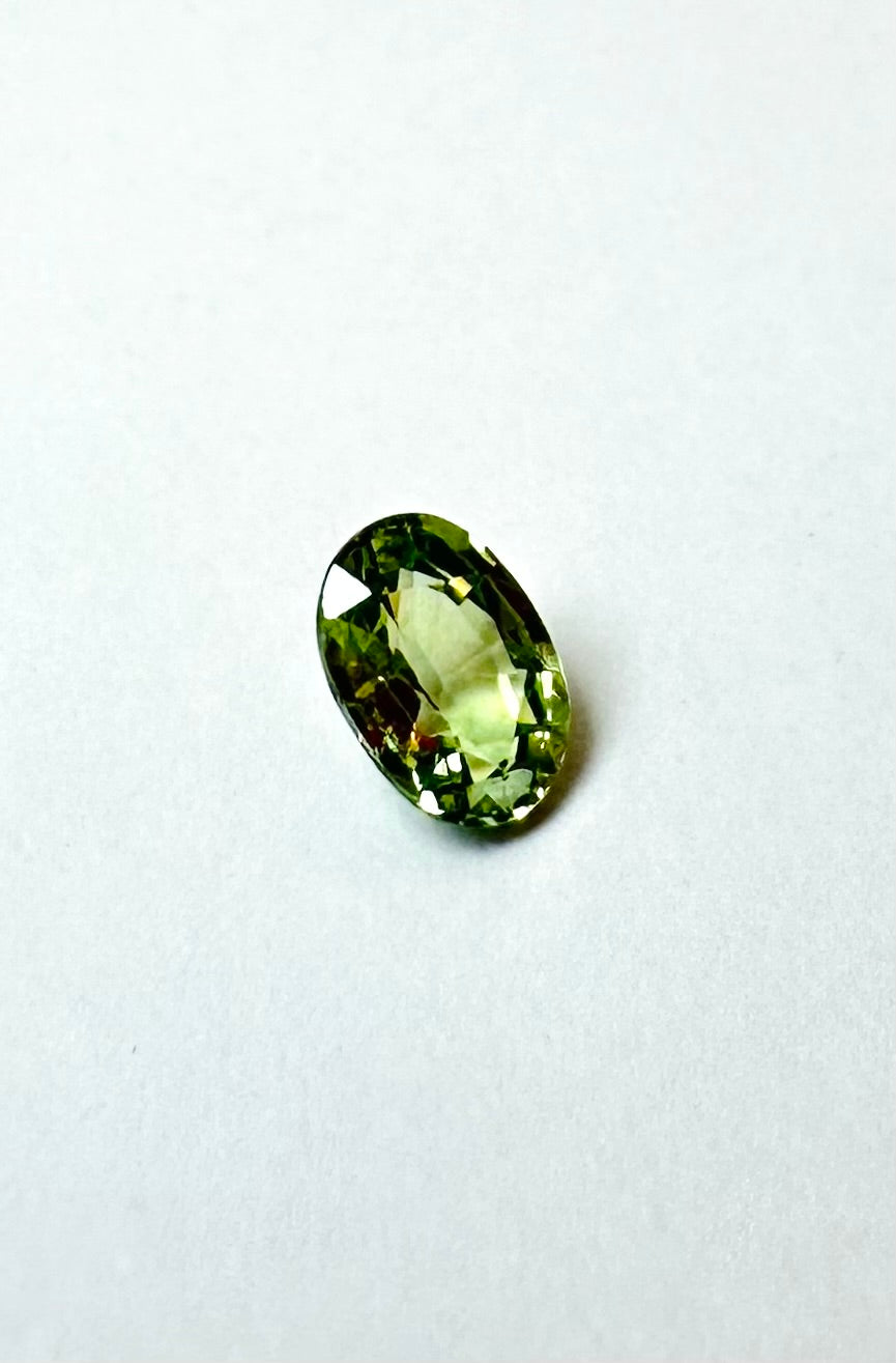 0.65cts 6.08x4.25mm Oval Faceted Green Sapphire