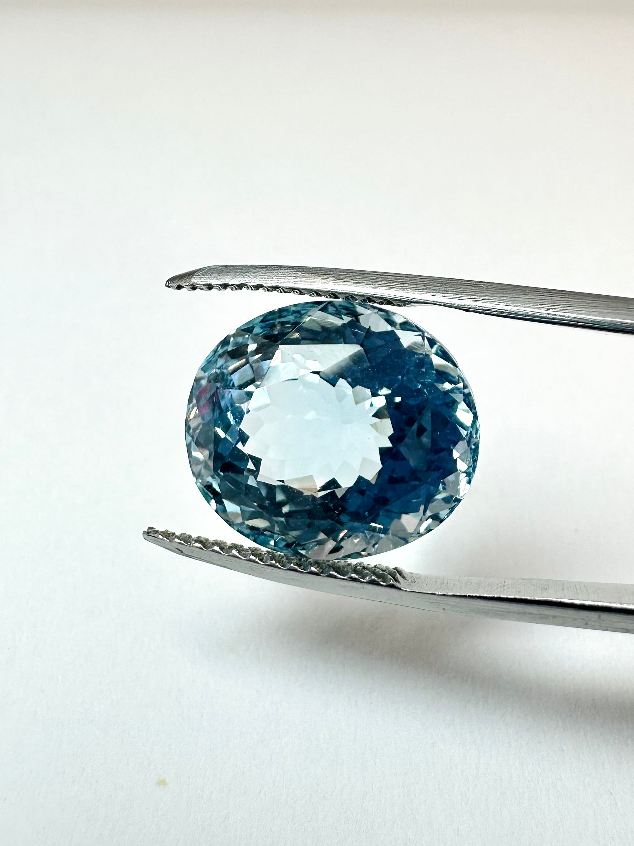12.40cts 14.10x12.25mm Oval Faceted Blue Topaz