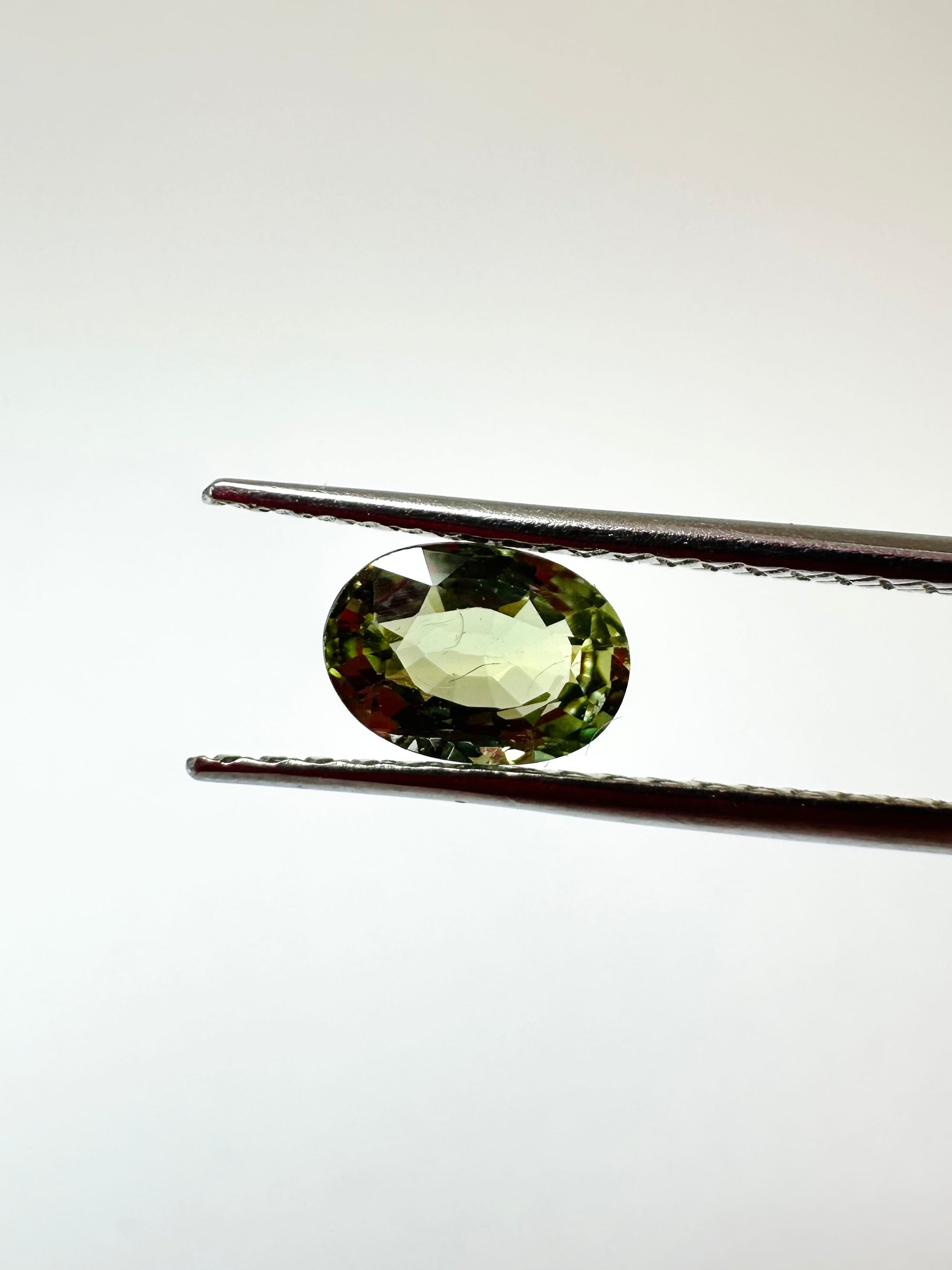 0.65cts 6.08x4.25mm Oval Faceted Green Sapphire