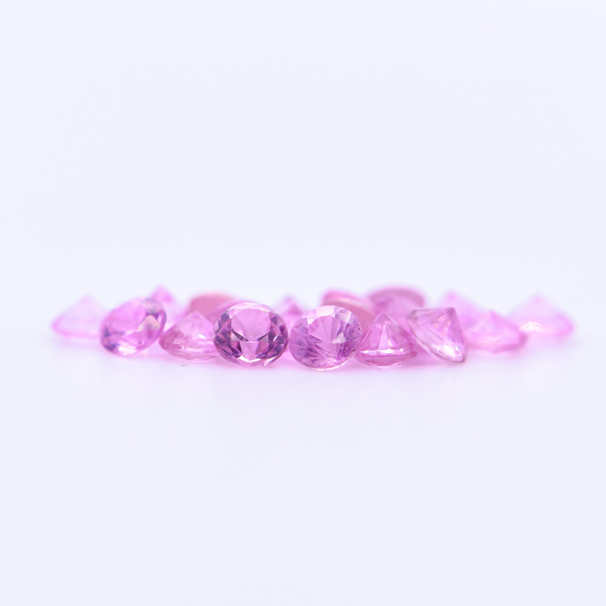 2.5mm Round Diamond Cut Pink Sapphires