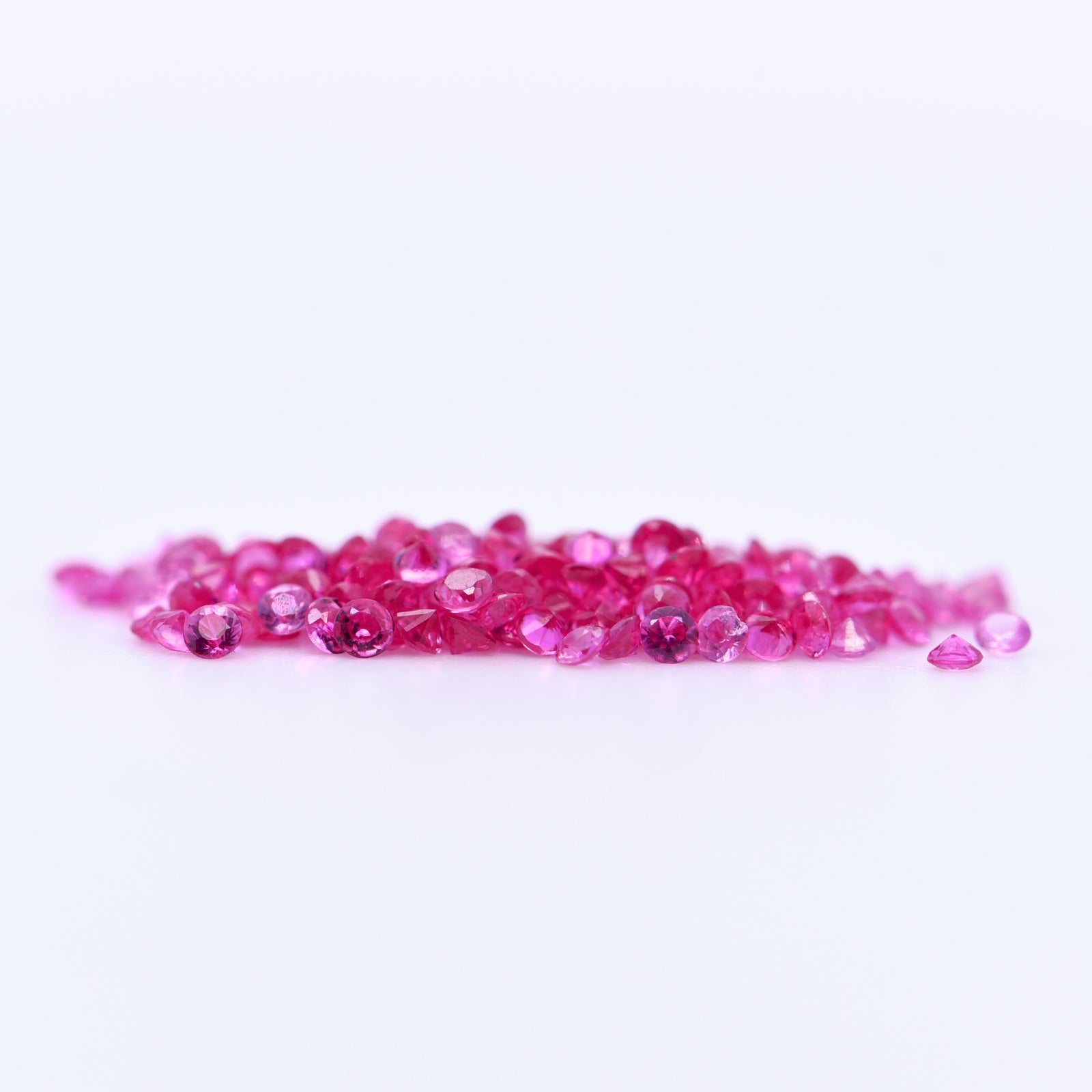 1.25mm Round Diamond Cut Pink Sapphires