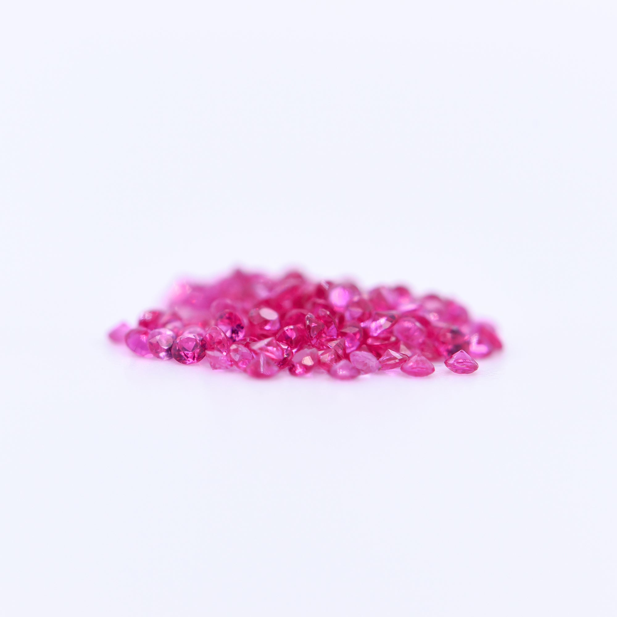 1.25mm Round Diamond Cut Pink Sapphires