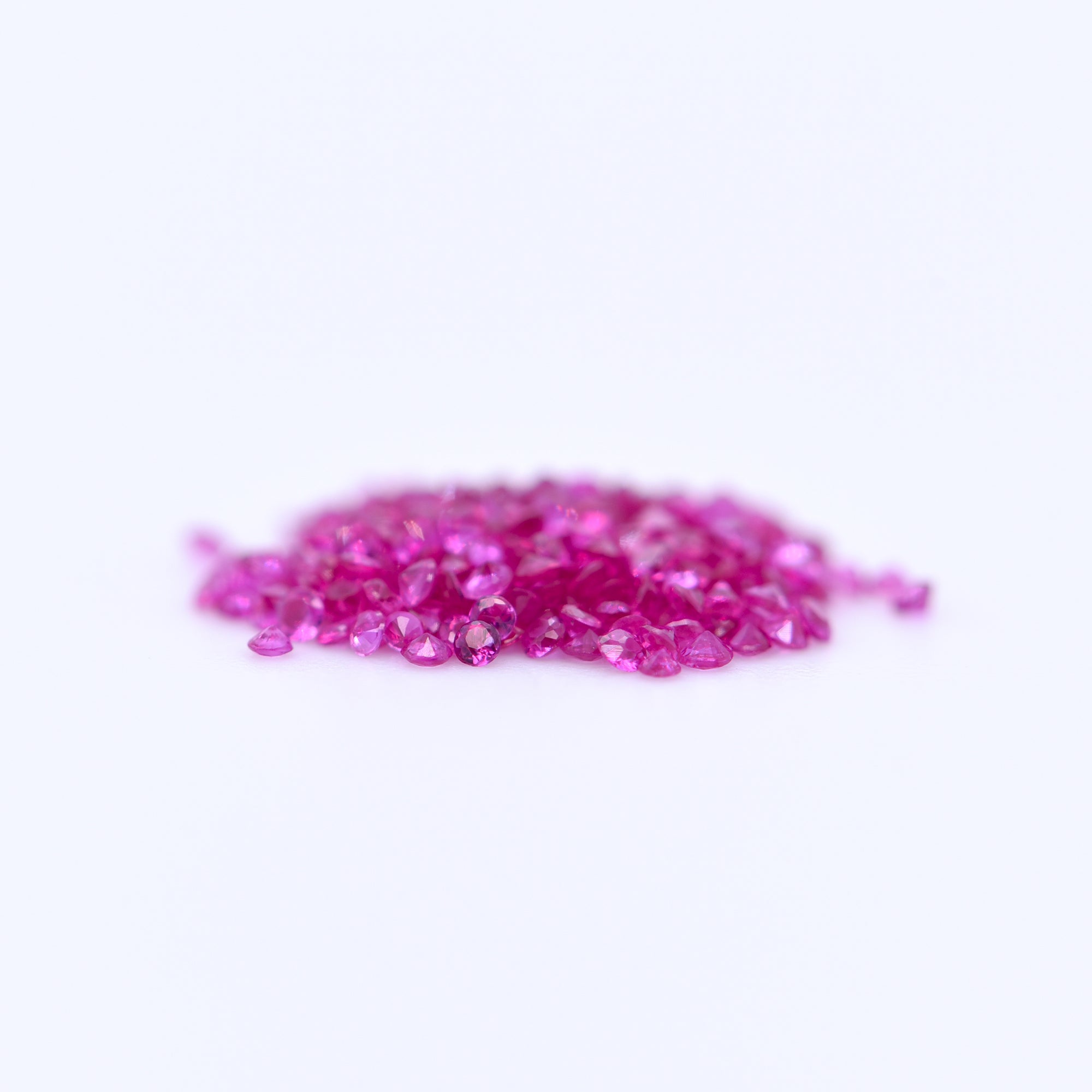 1mm Round Diamond Cut Pink Rubies