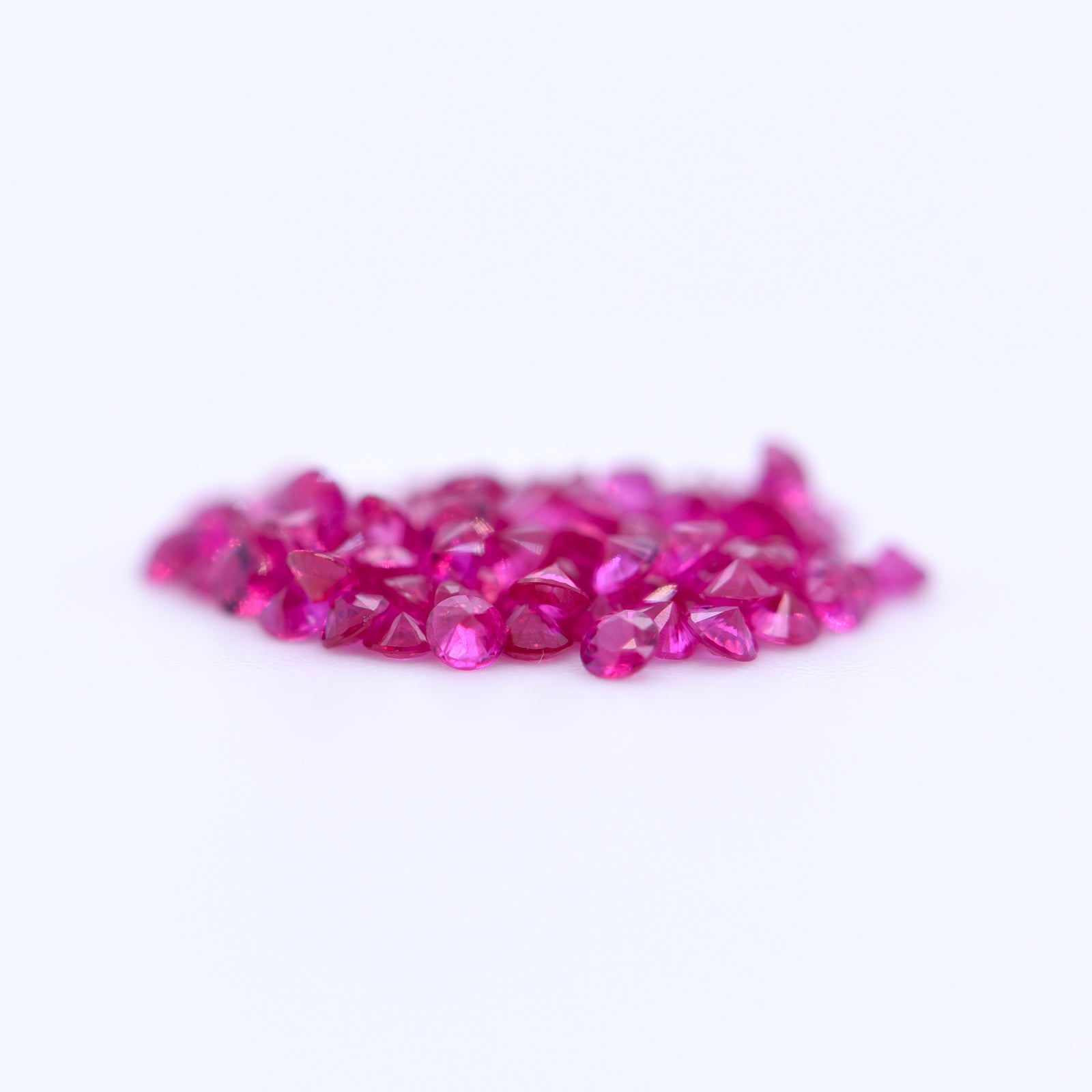 1.5mm Round Diamond Cut Pink Rubies