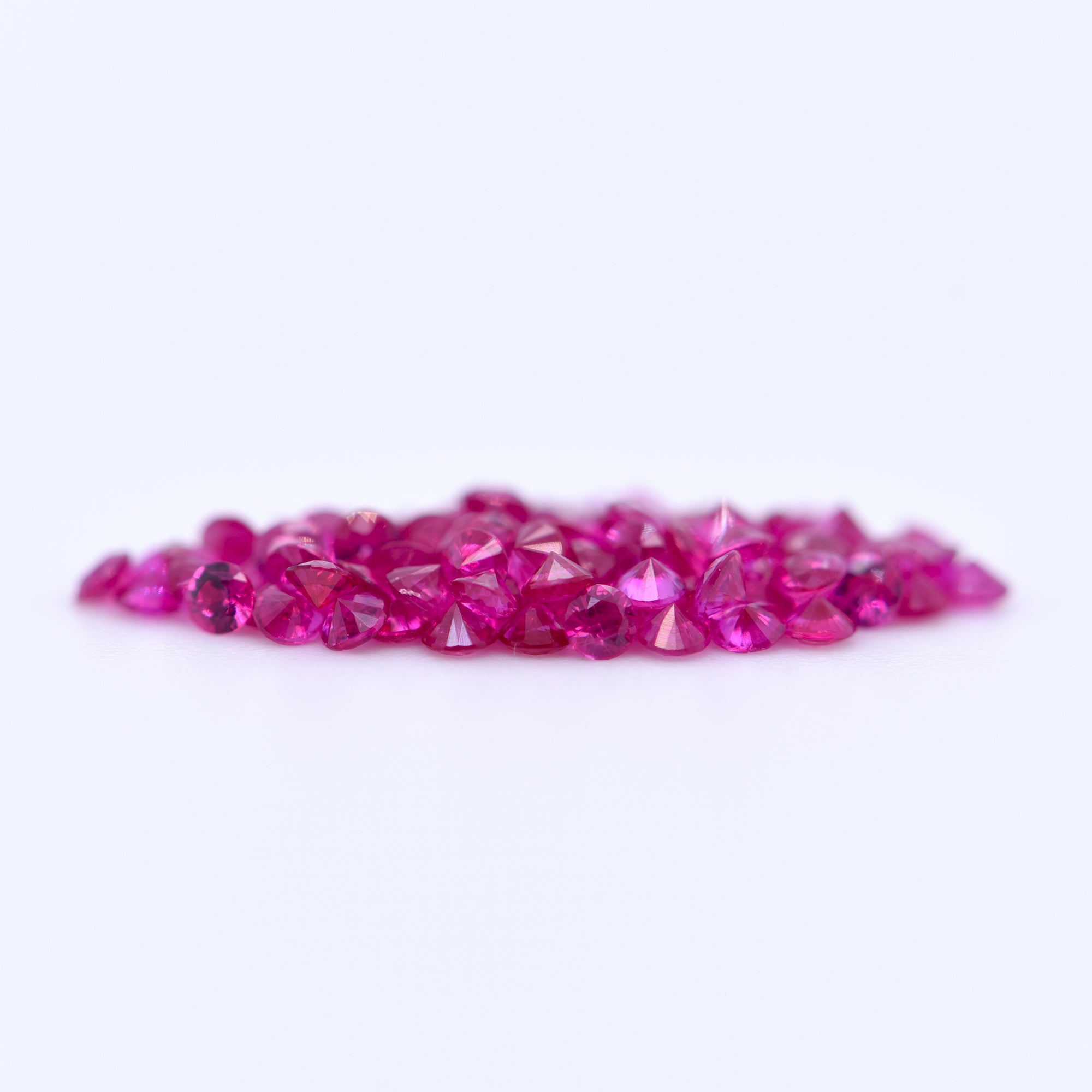 1.5mm Round Diamond Cut Pink Rubies