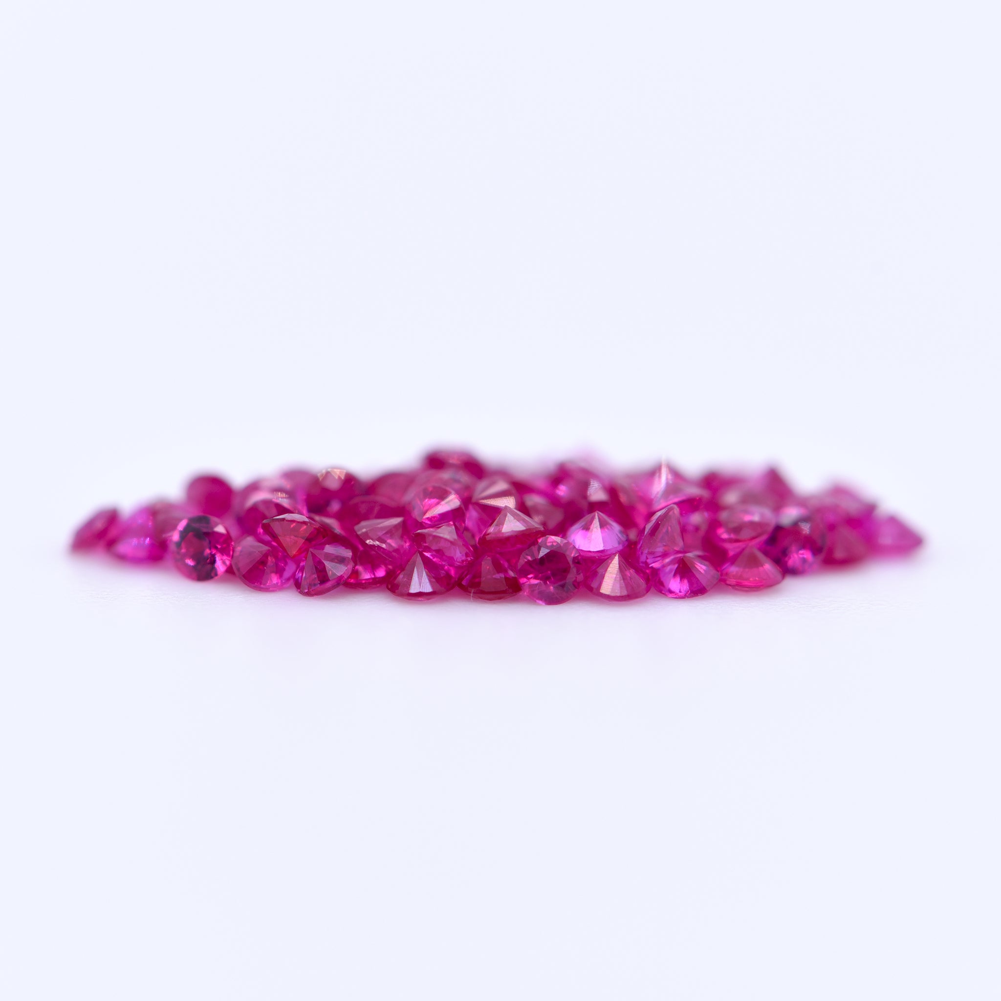 1.5mm Round Diamond Cut Pink Rubies