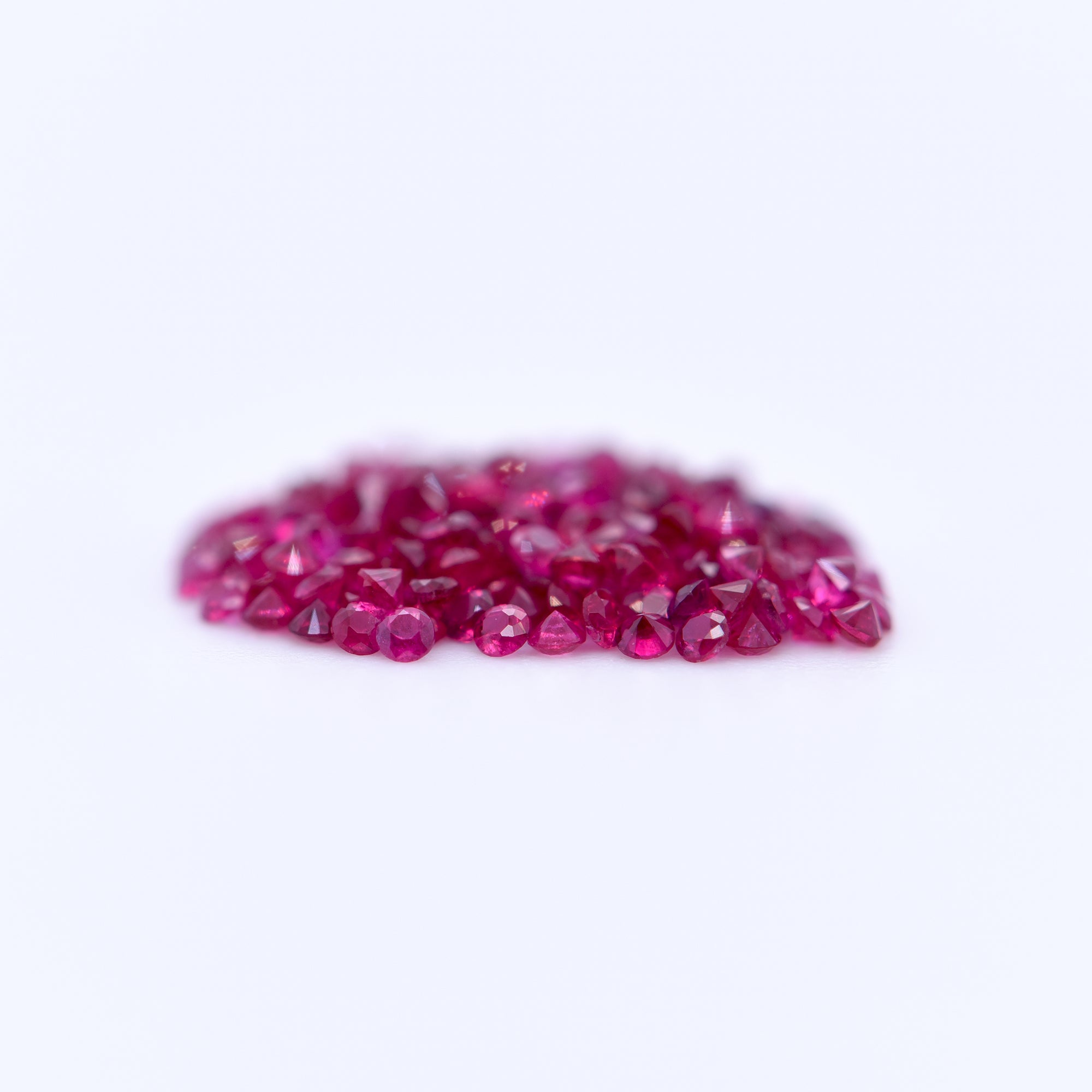 1.25mm Round Diamond Cut Red Rubies