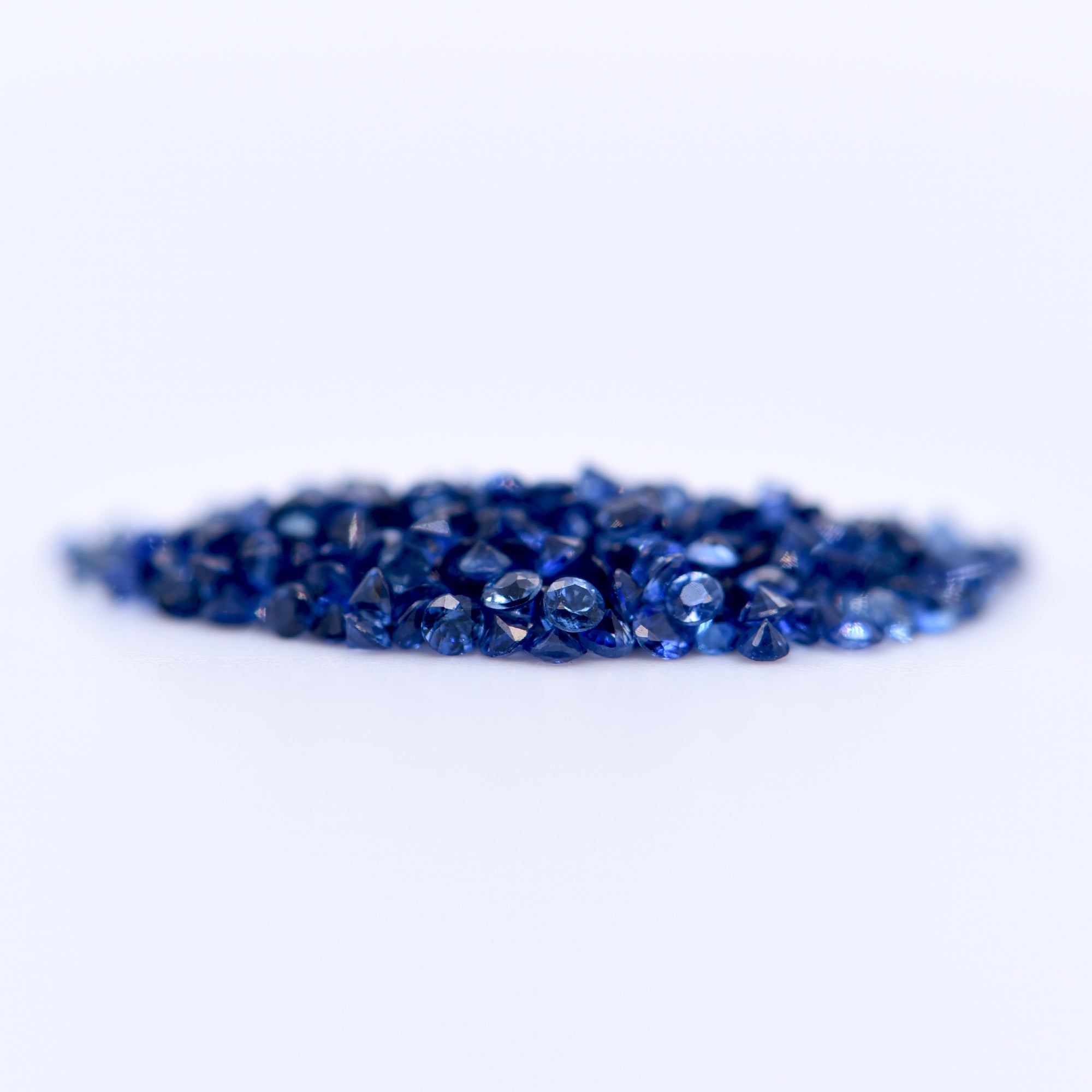 1.25mm Round Diamond Cut Blue Sapphires