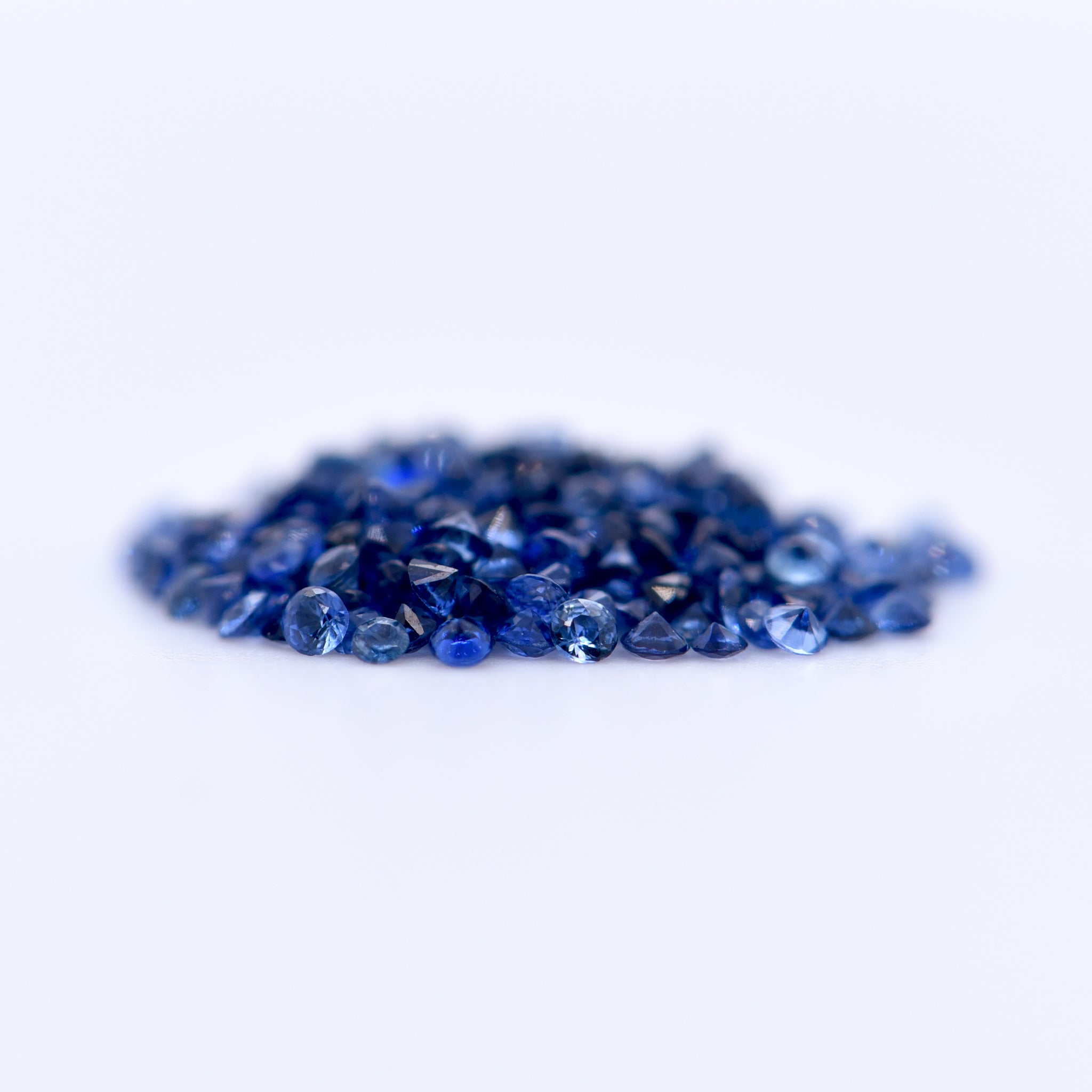 1.25mm Round Diamond Cut Blue Sapphires