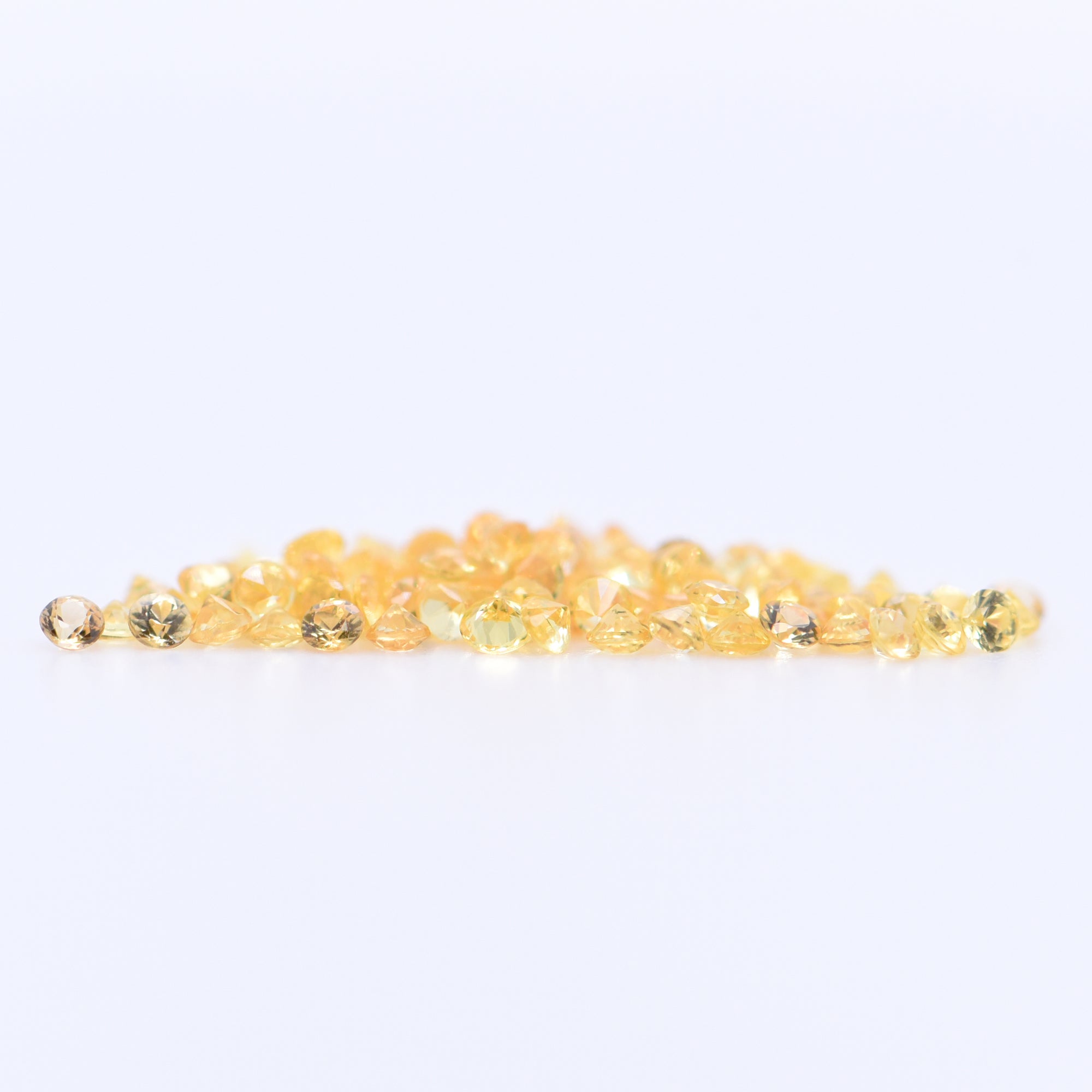 1.25mm Round Diamond Cut Yellow Sapphires