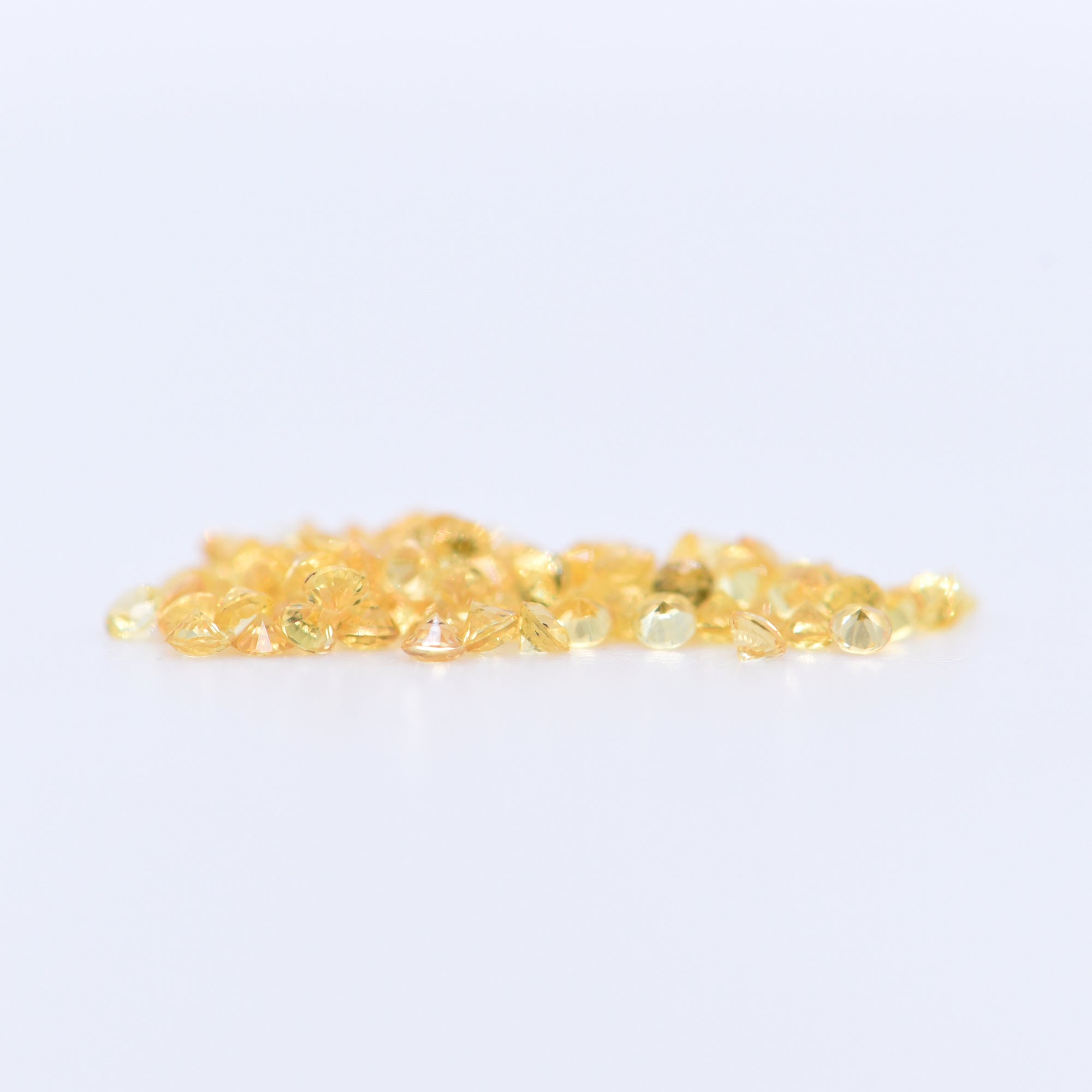 1.25mm Round Diamond Cut Yellow Sapphires