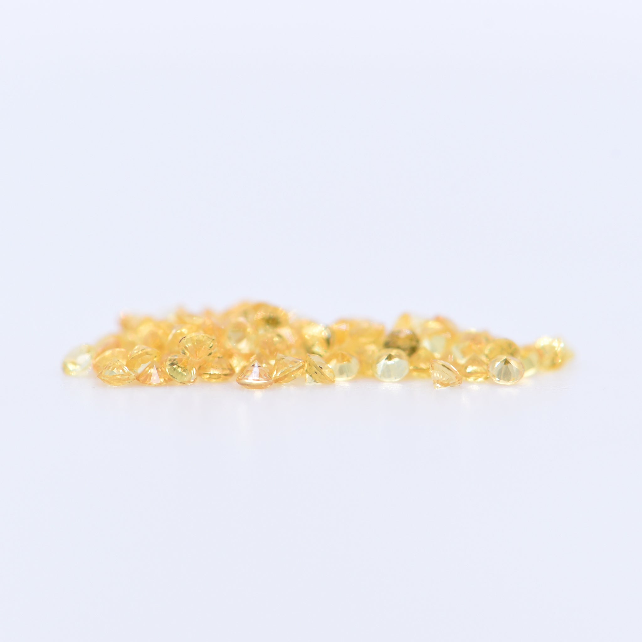 1.25mm Round Diamond Cut Yellow Sapphires