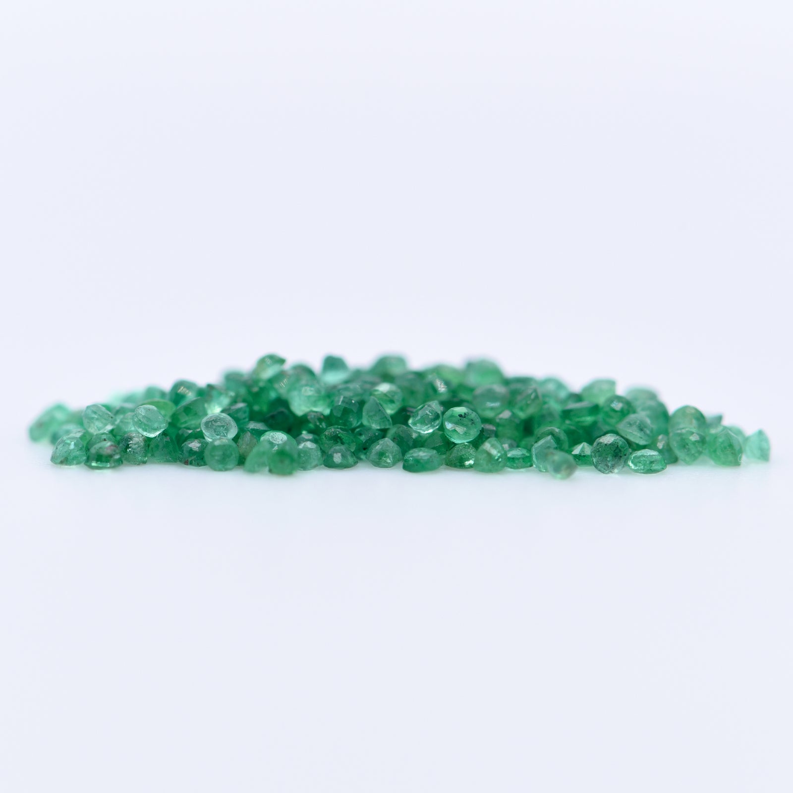 1.25mm Round Faceted Emeralds