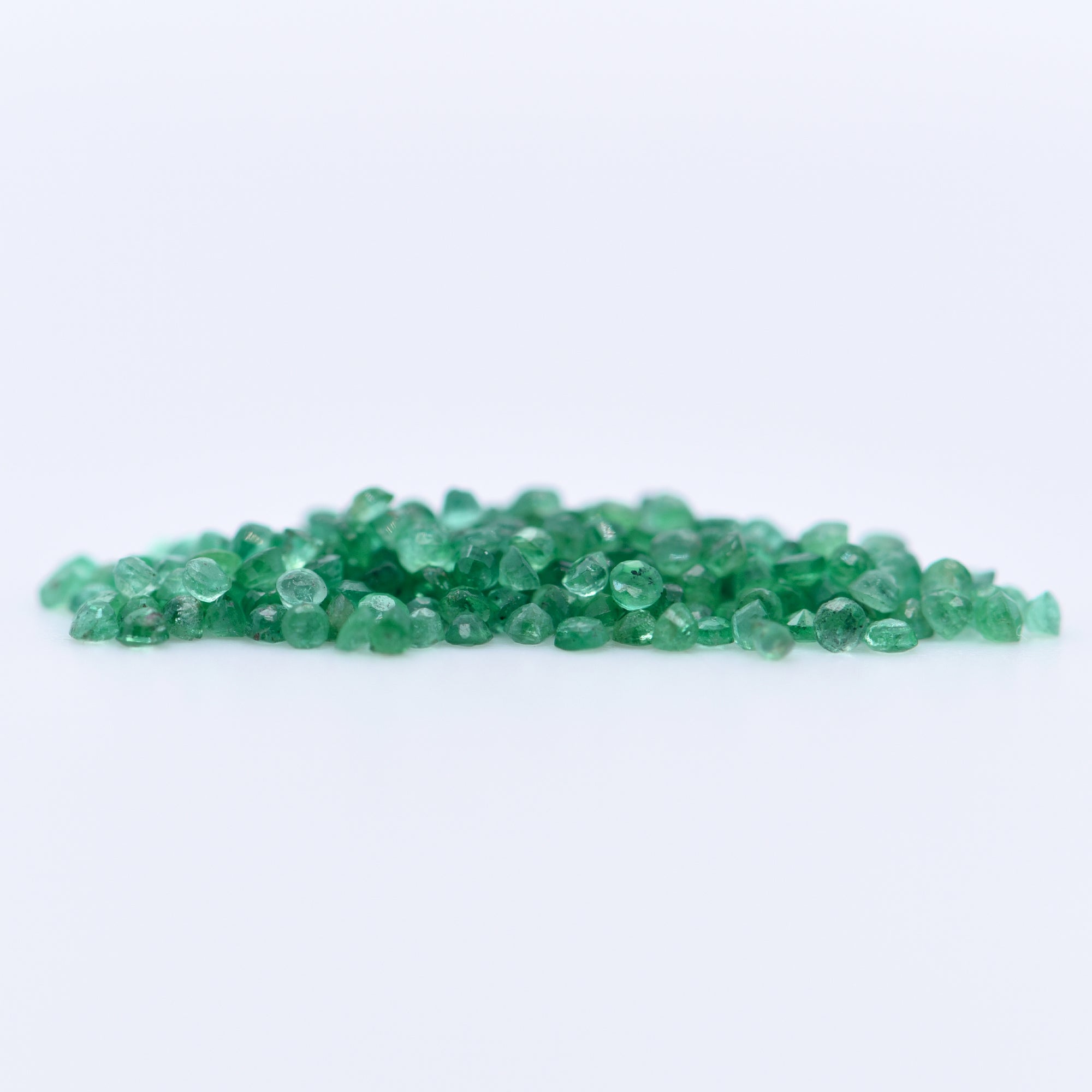 1.25mm Round Faceted Emeralds