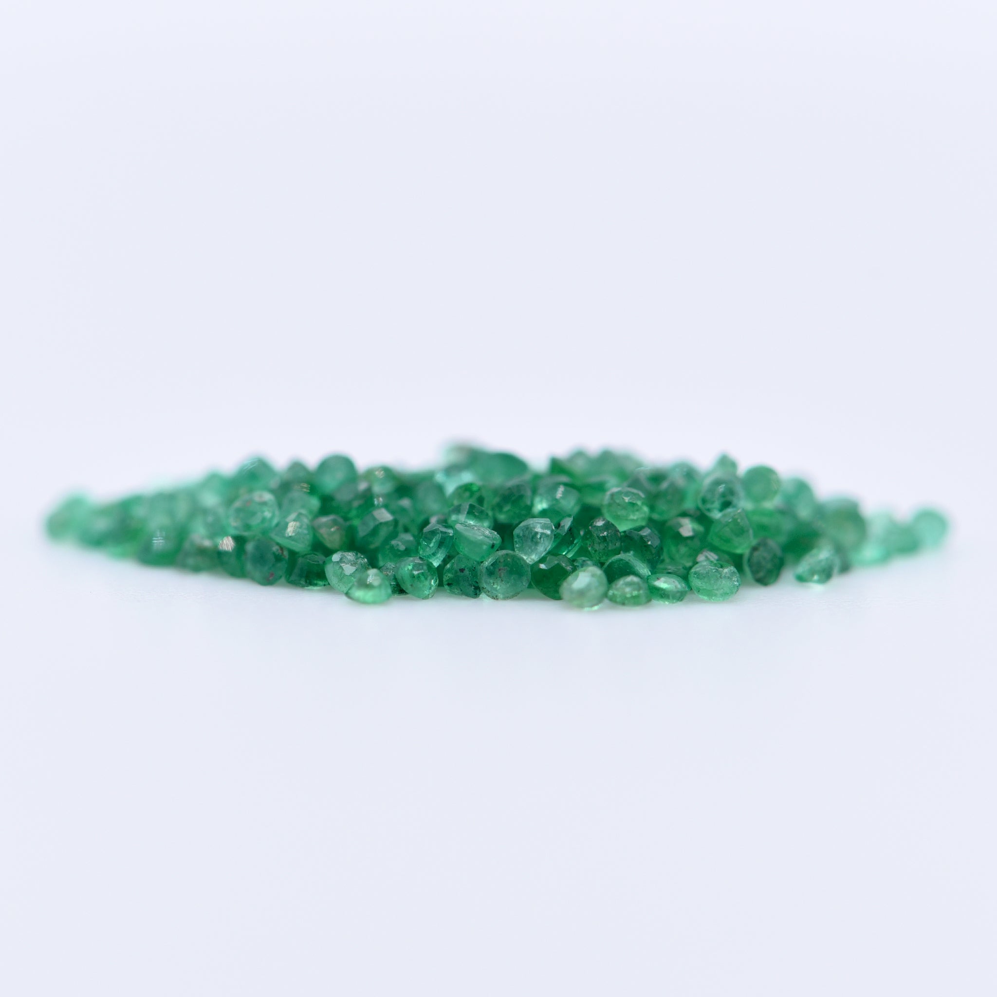 1.25mm Round Faceted Emeralds