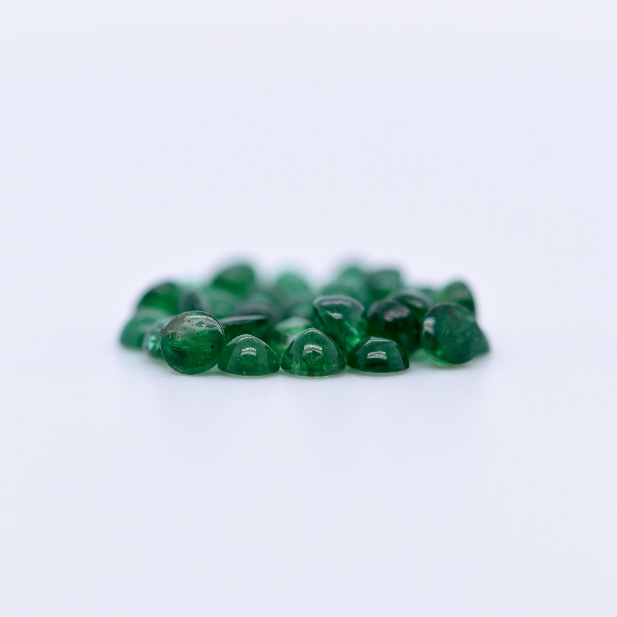 2.5mm Round Cabochon Emeralds