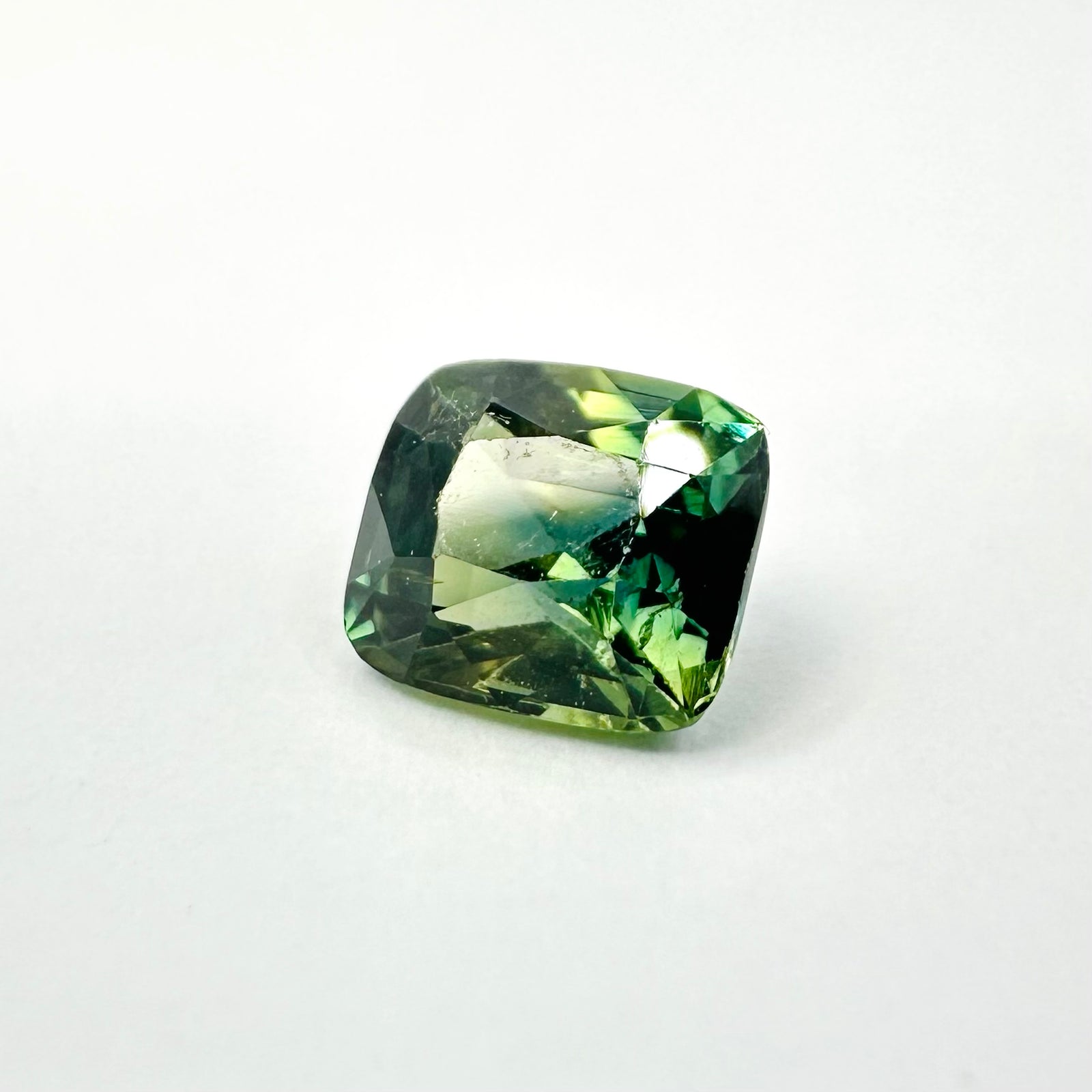 1.07cts 5.8x5mm Cushion Shaped Faceted Green Sapphire