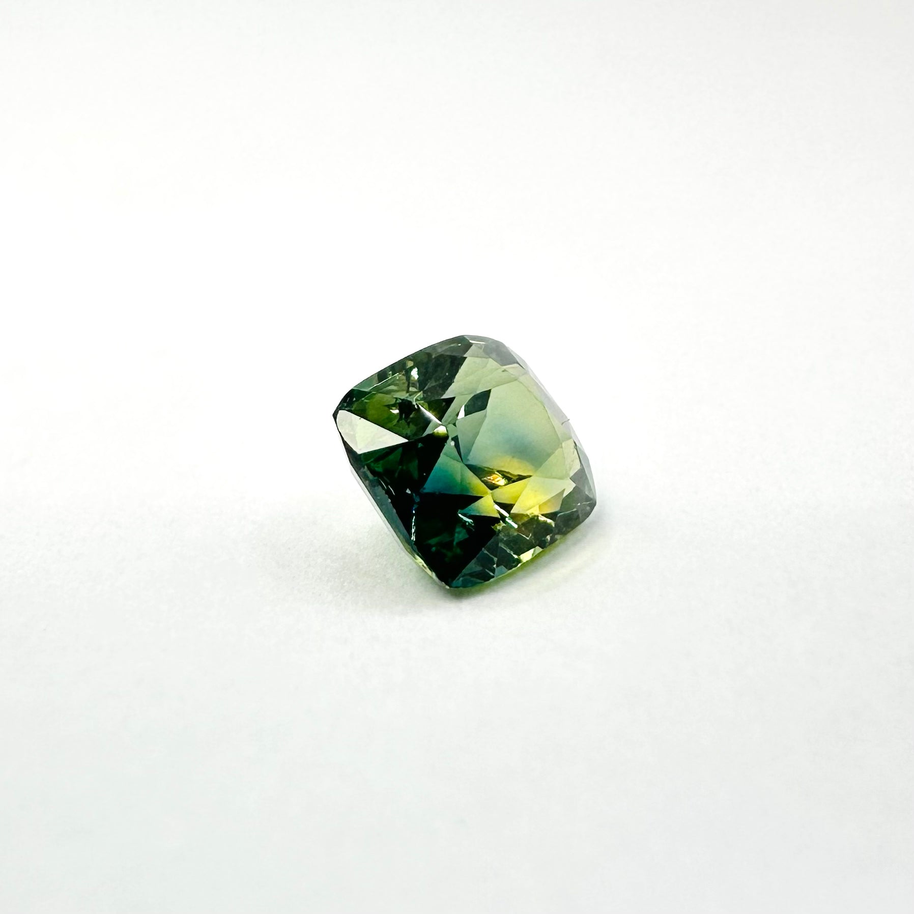 1.07cts 5.8x5mm Cushion Shaped Faceted Green Sapphire