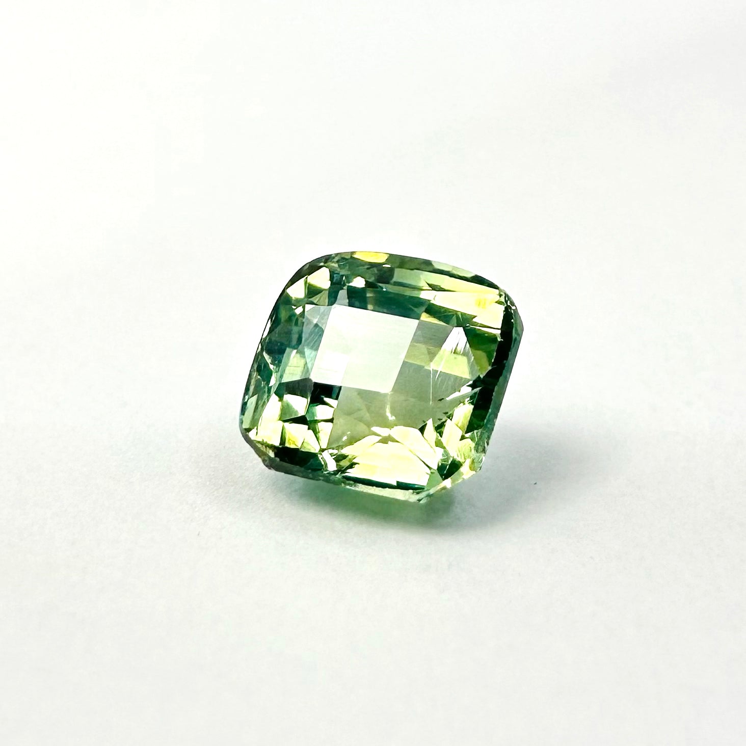 1.26cts 5.3x5.5mm Cushion Shaped Faceted Teal-Green Sapphire