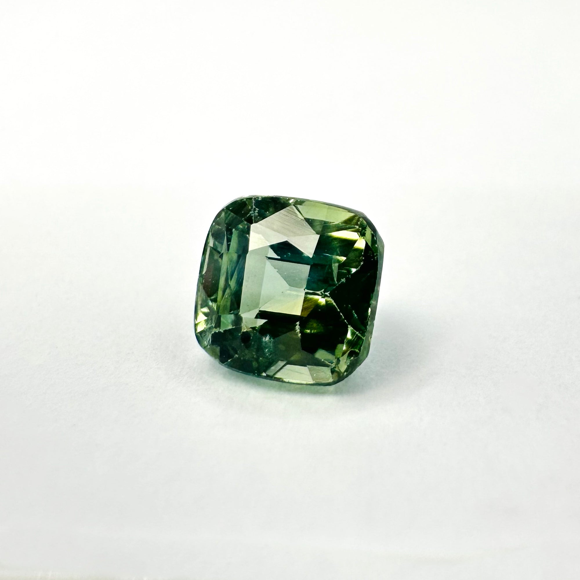 1.26cts 5.3x5.5mm Cushion Shaped Faceted Teal-Green Sapphire