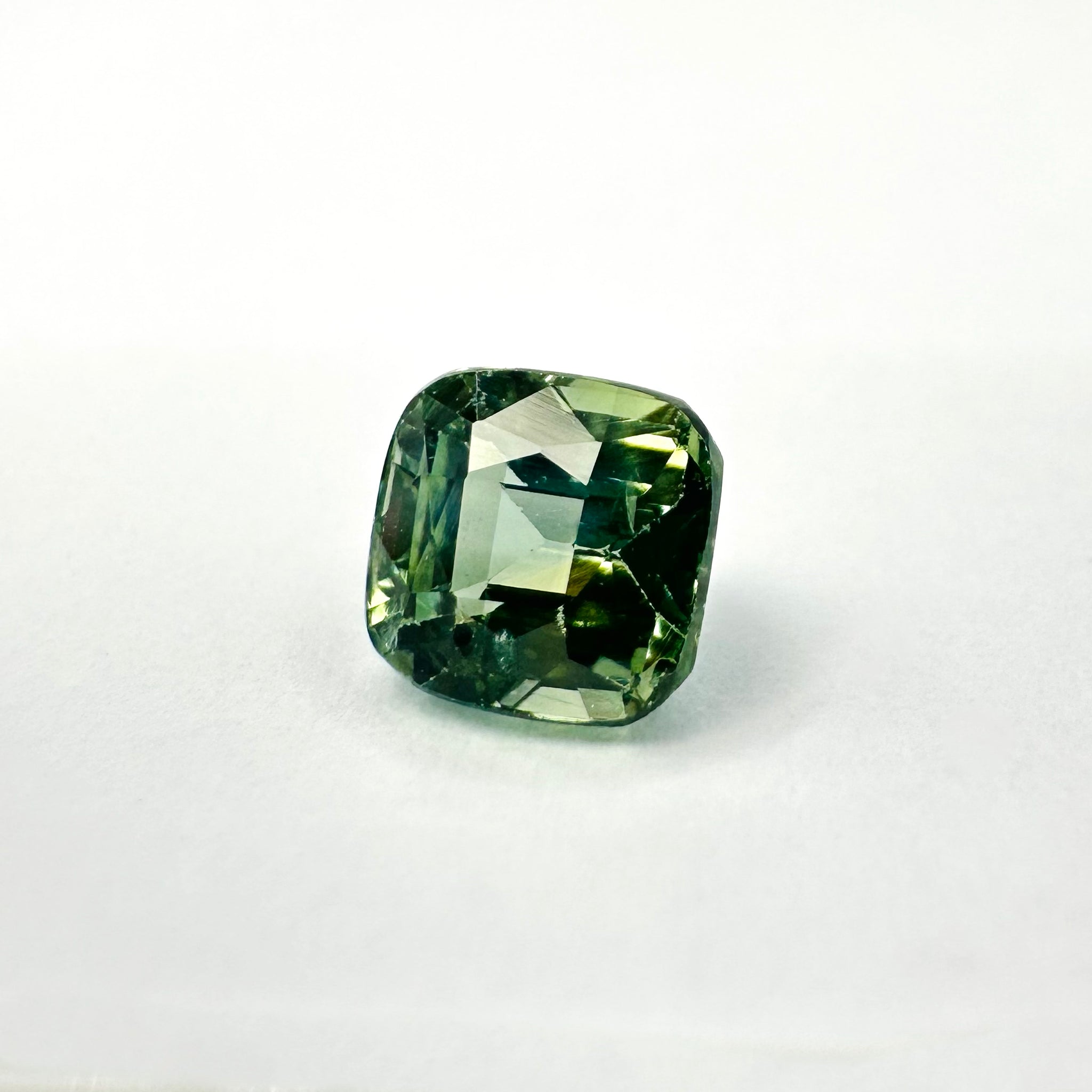 1.26cts 5.3x5.5mm Cushion Shaped Faceted Teal-Green Sapphire