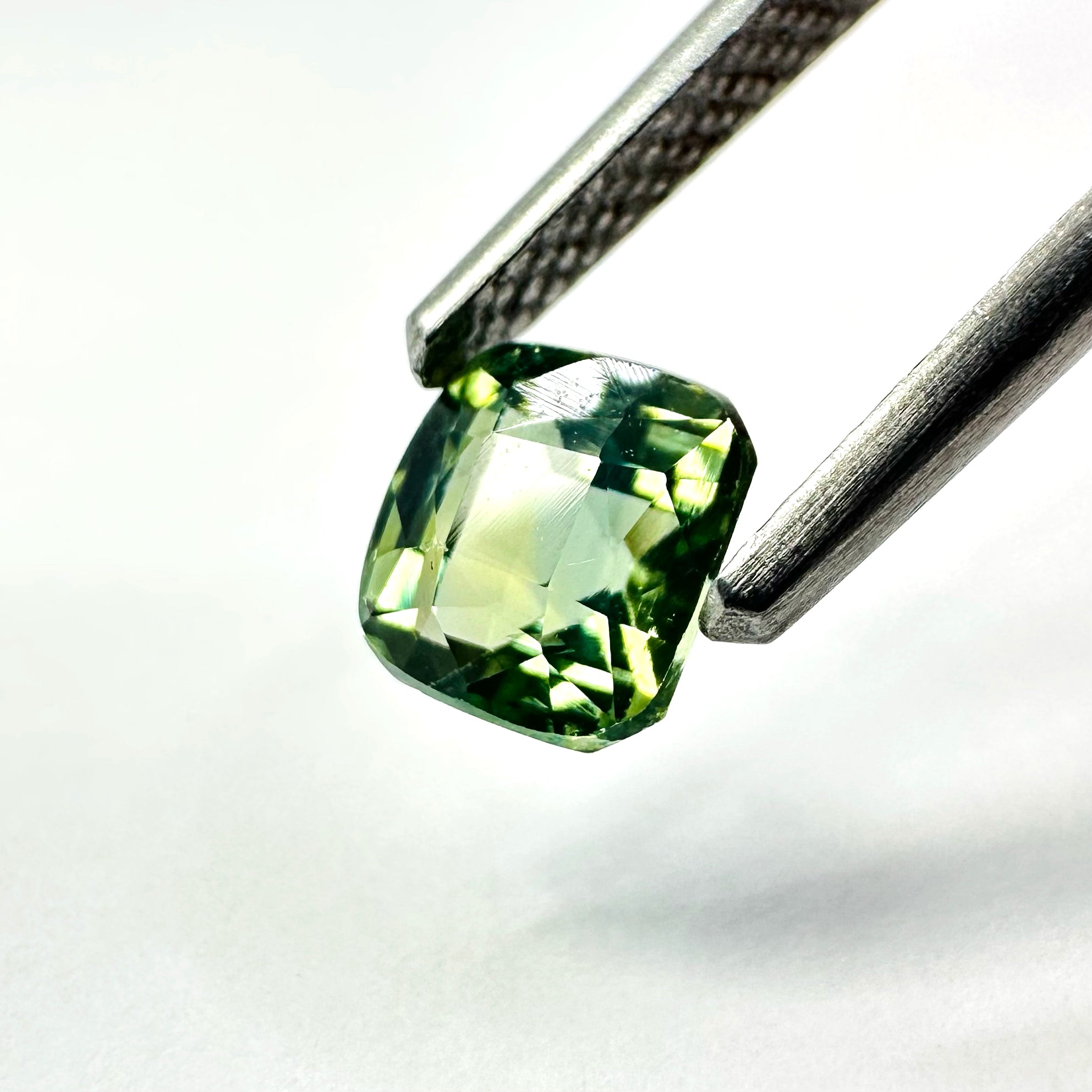 1.26cts 5.3x5.5mm Cushion Shaped Faceted Teal-Green Sapphire