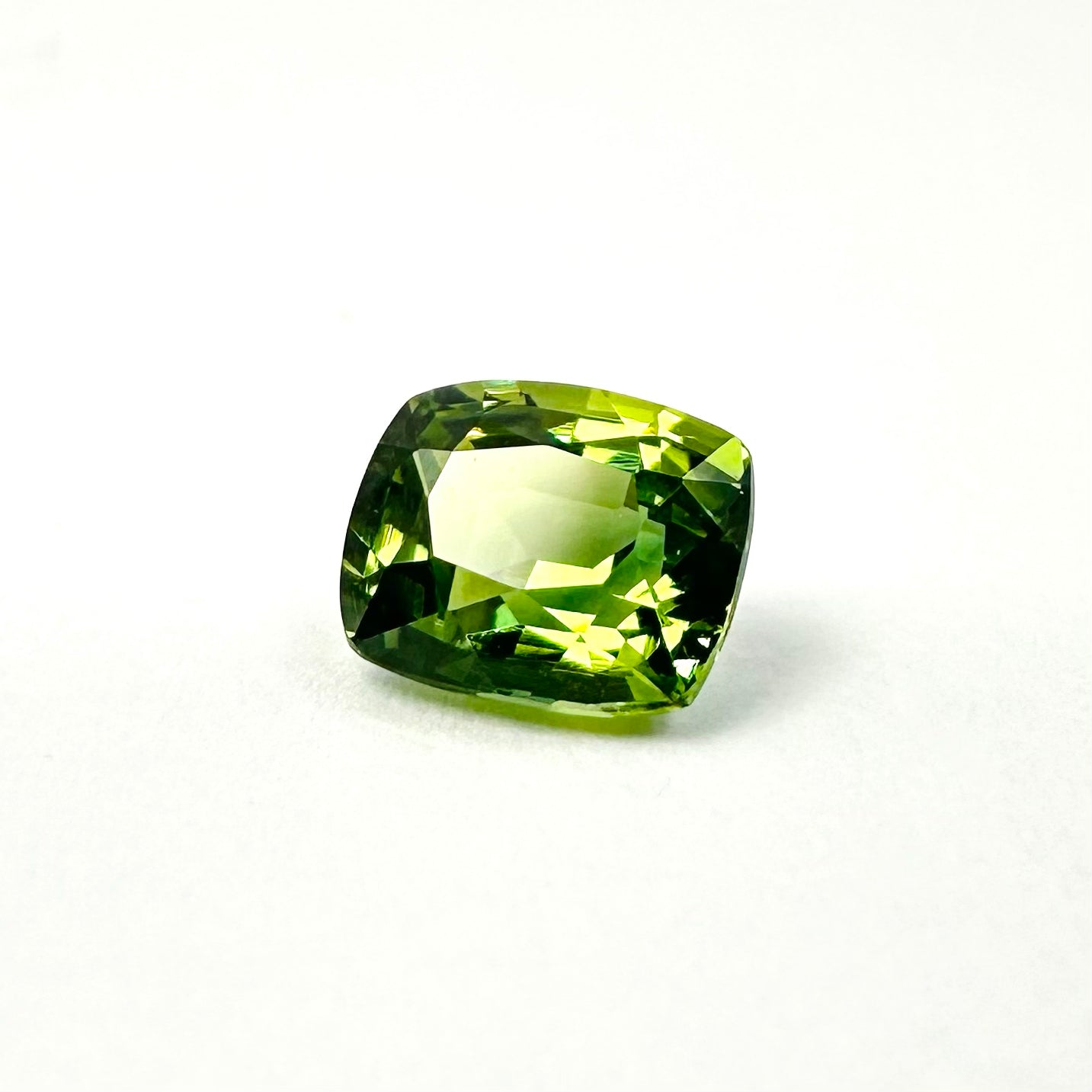 0.87cts 5.6x4.7mm Cushion Cut Faceted Green Sapphire