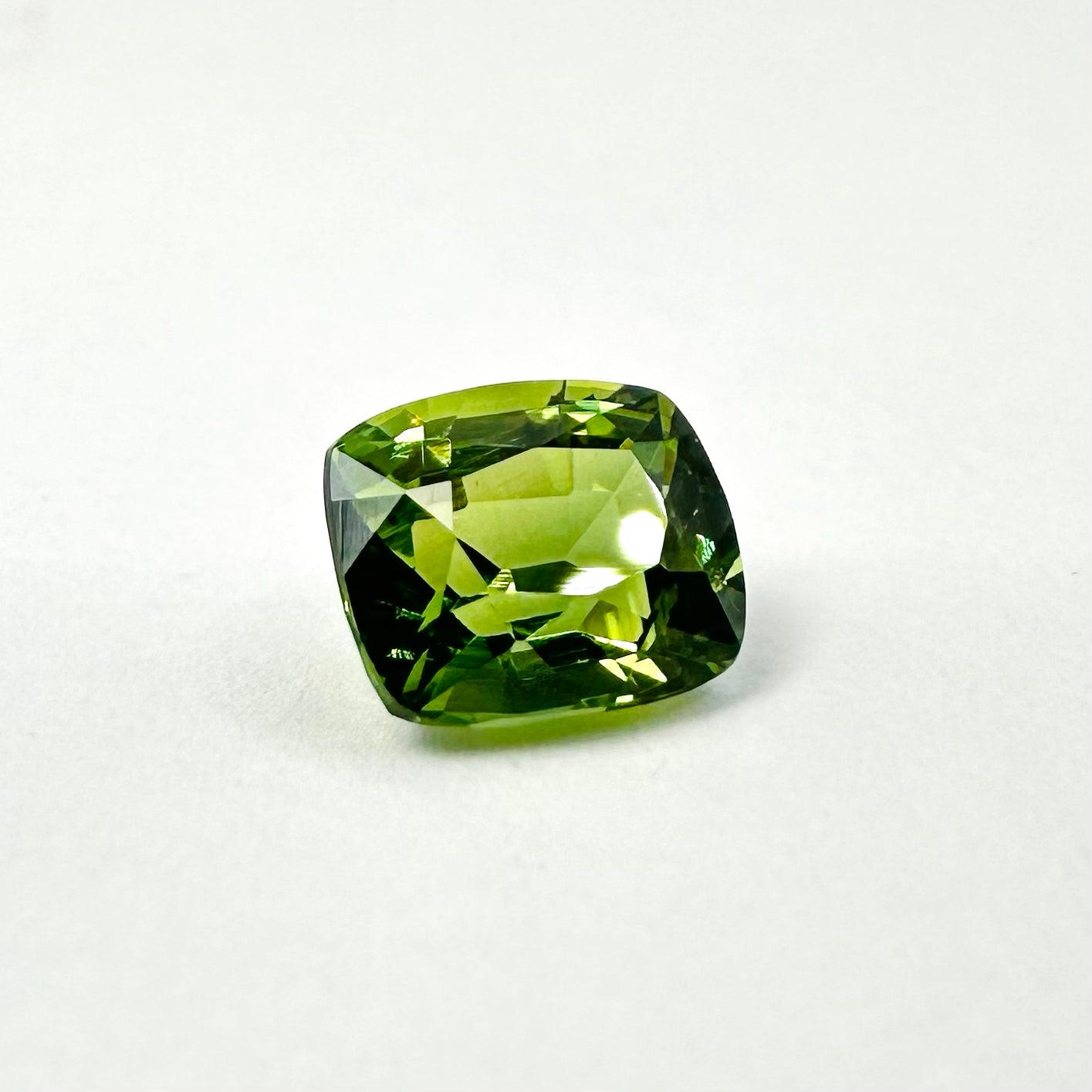 0.87cts 5.6x4.7mm Cushion Cut Faceted Green Sapphire