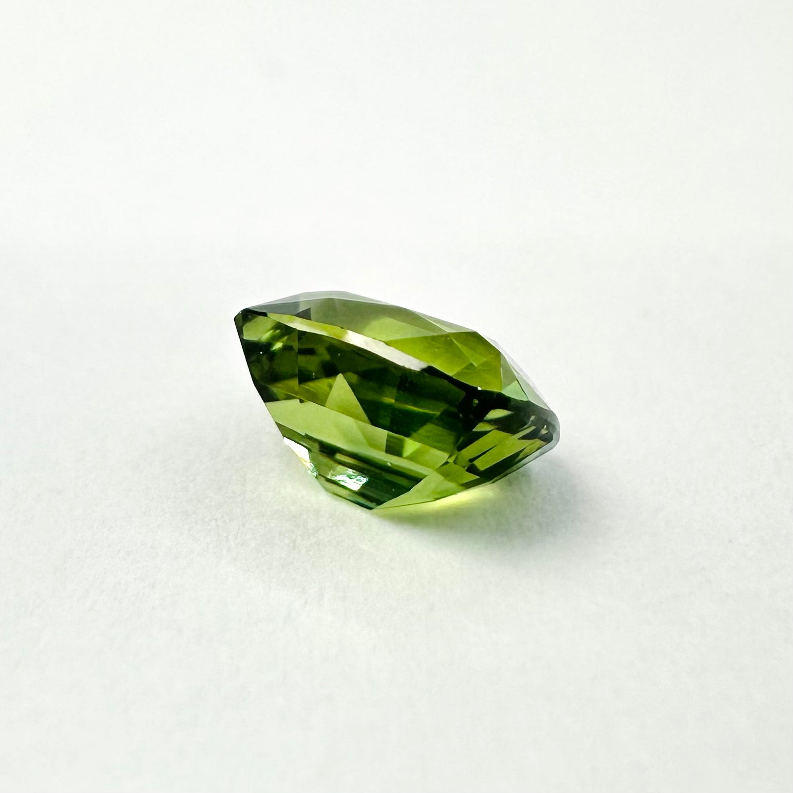 0.87cts 5.6x4.7mm Cushion Cut Faceted Green Sapphire