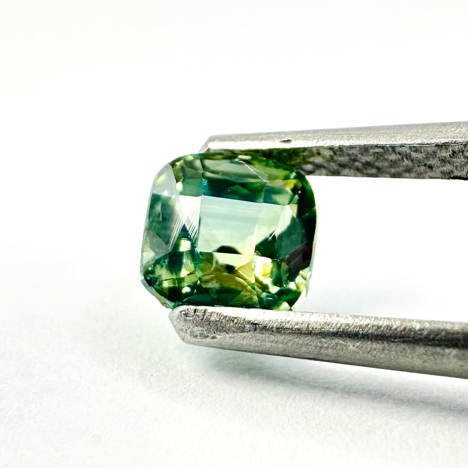 1.26cts 5.3x5.5mm Cushion Shaped Faceted Teal-Green Sapphire