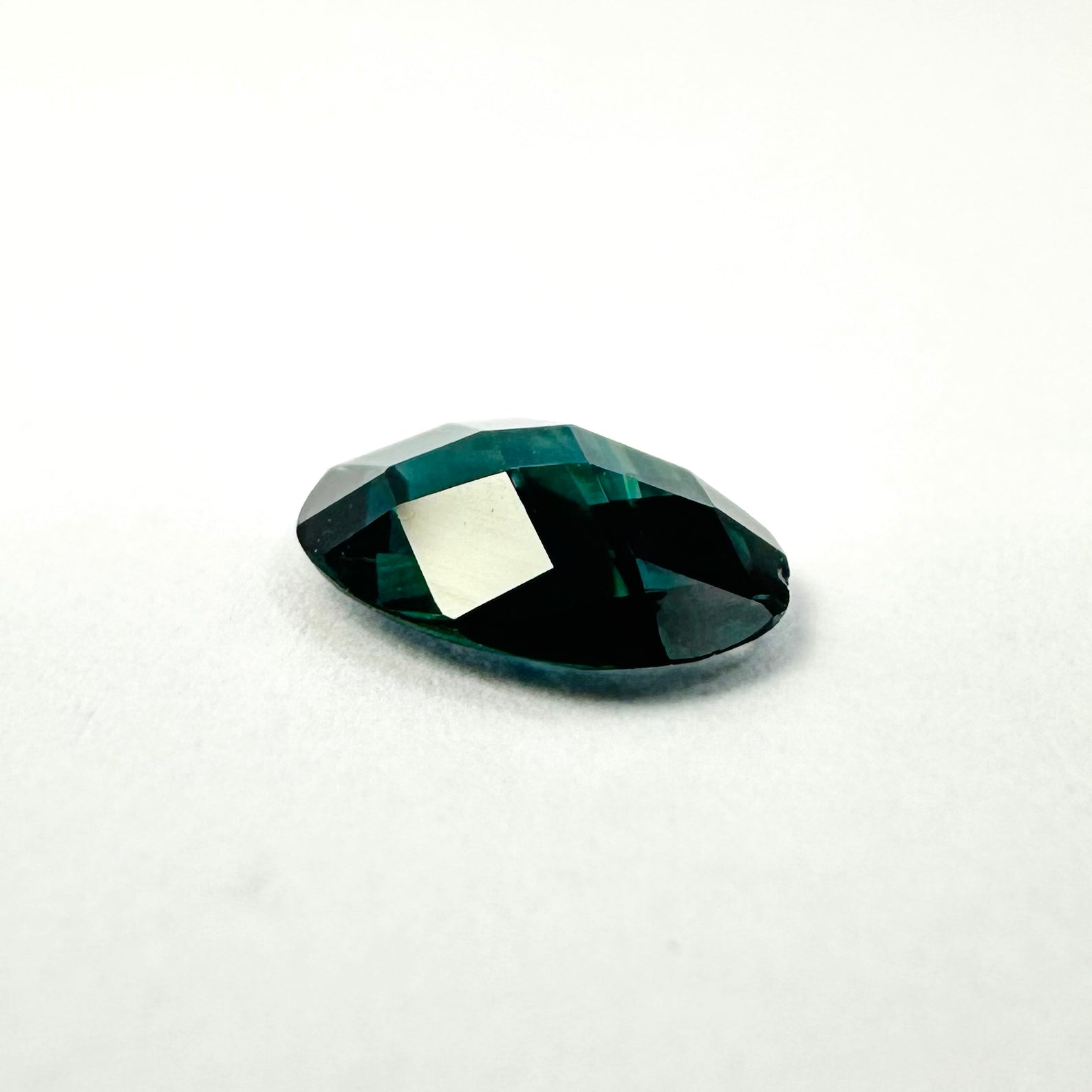 0.94cts 7.7x6mm Oval Checkerboard Cut Teal-Blue Sapphire