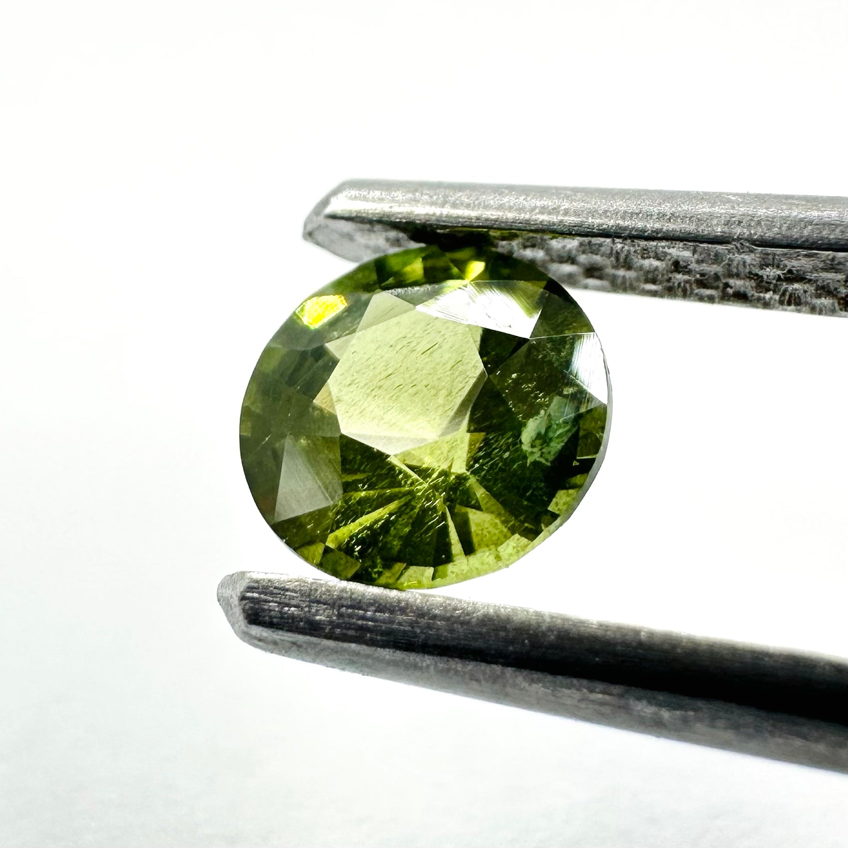 0.58cts 5mm Round Faceted Green Sapphire