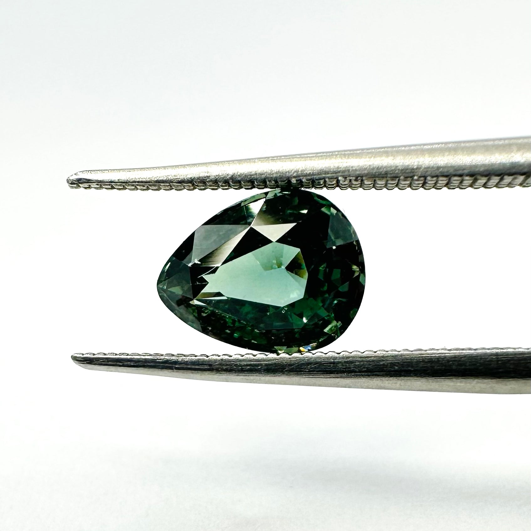 1.25cts 7x5.5mm Pear Shaped Faceted Teal-Green Sapphire