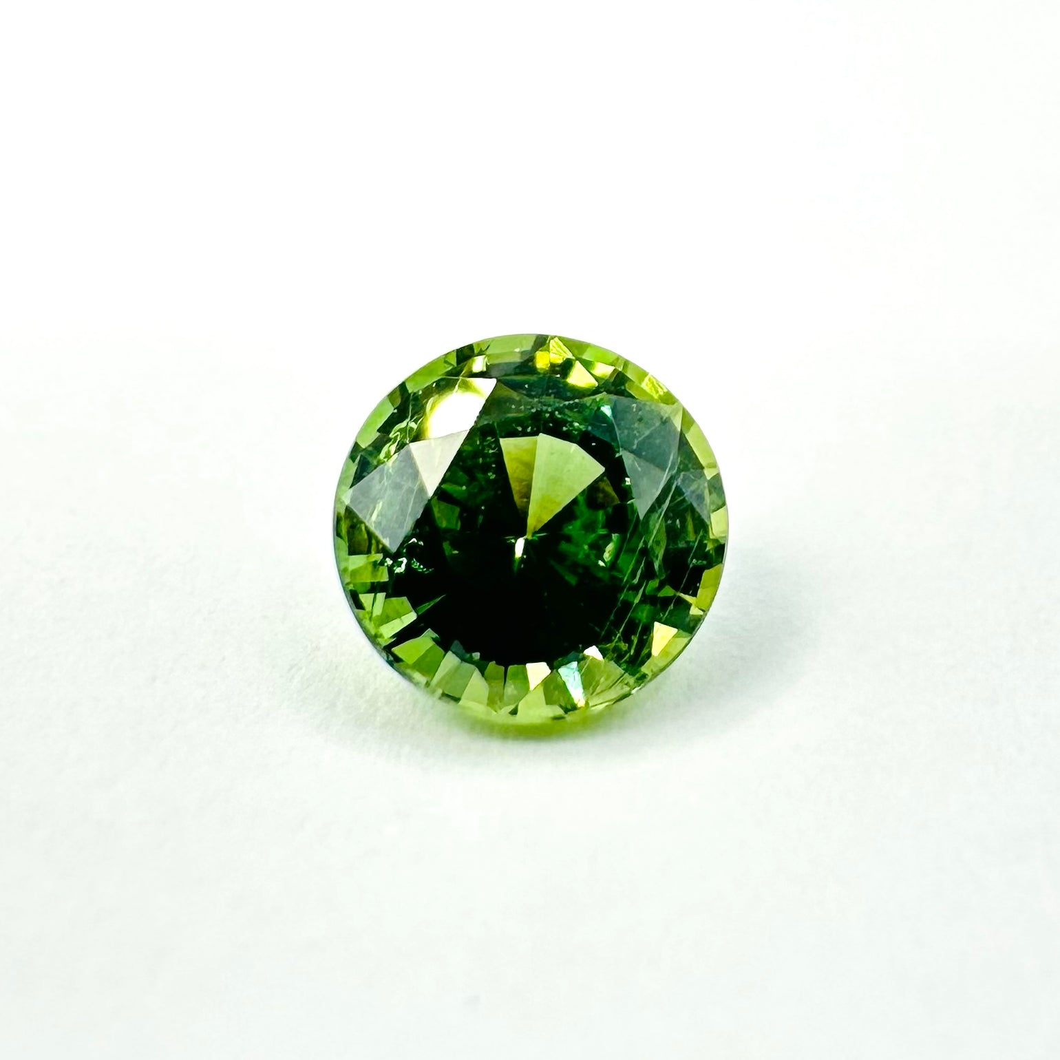 0.79cts 5.4mm Round Faceted Green Sapphire
