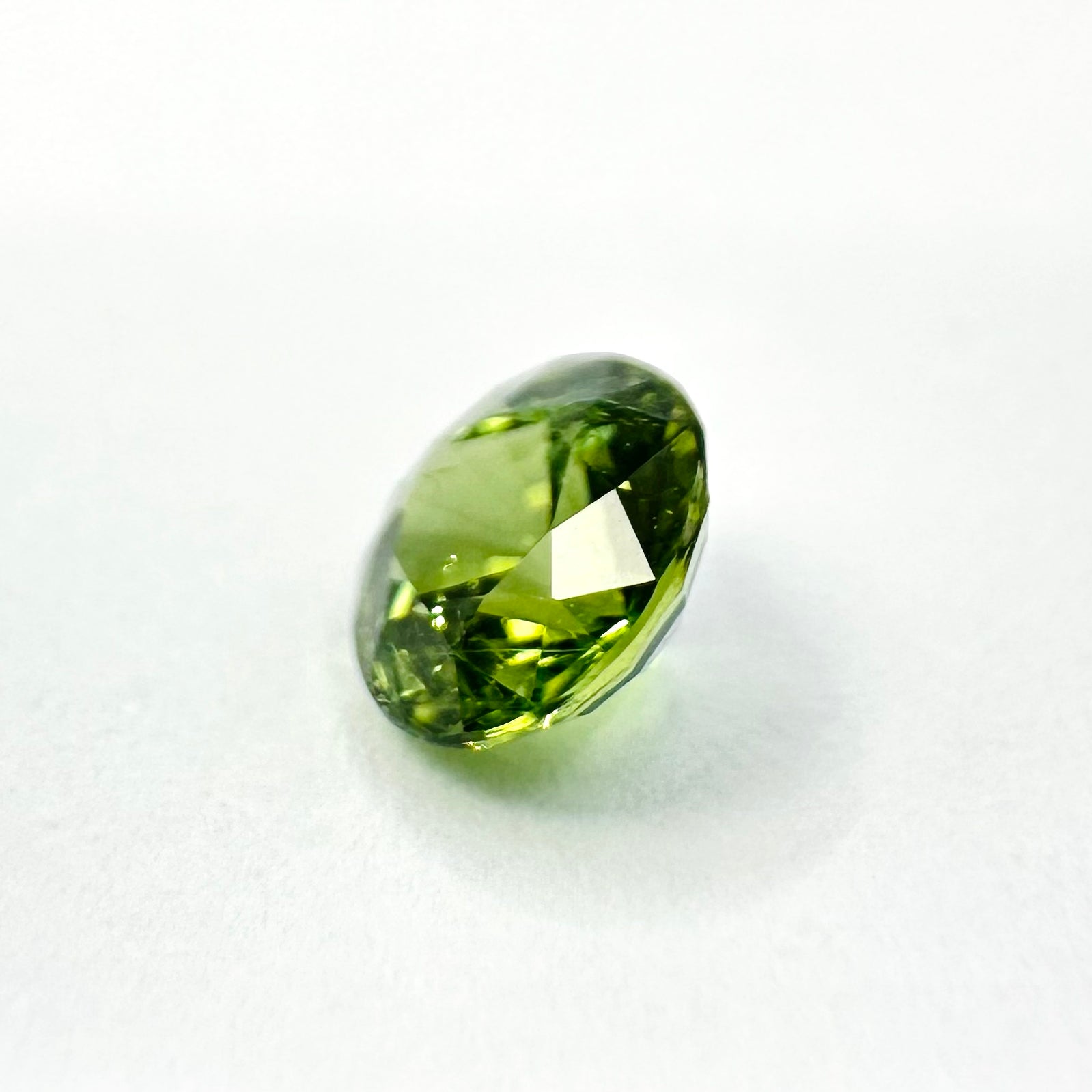 0.79cts 5.4mm Round Faceted Green Sapphire