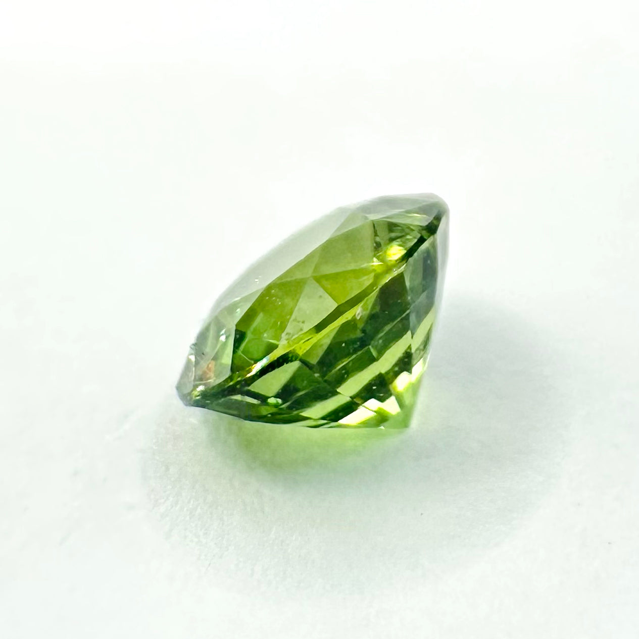 0.79cts 5.4mm Round Faceted Green Sapphire