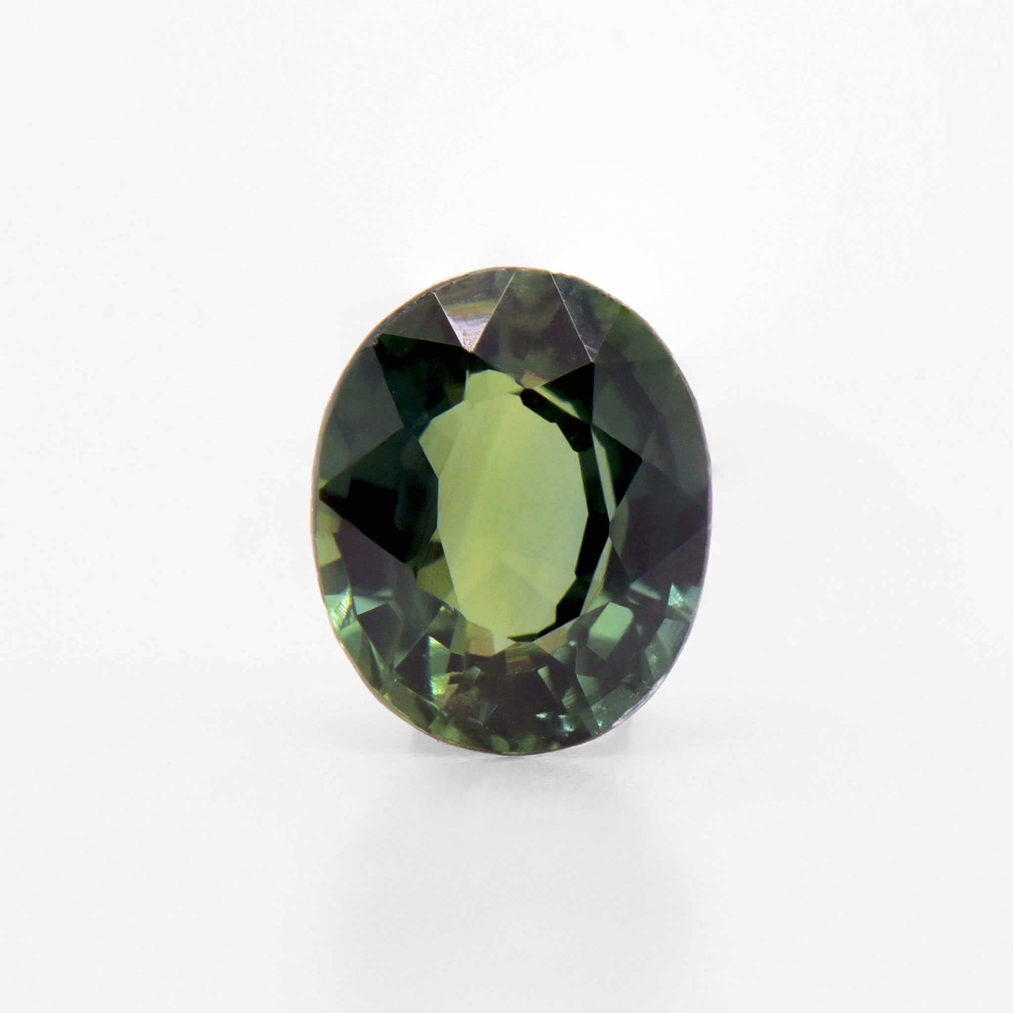 0.76cts 6x5mm Oval Faceted Green Sapphire