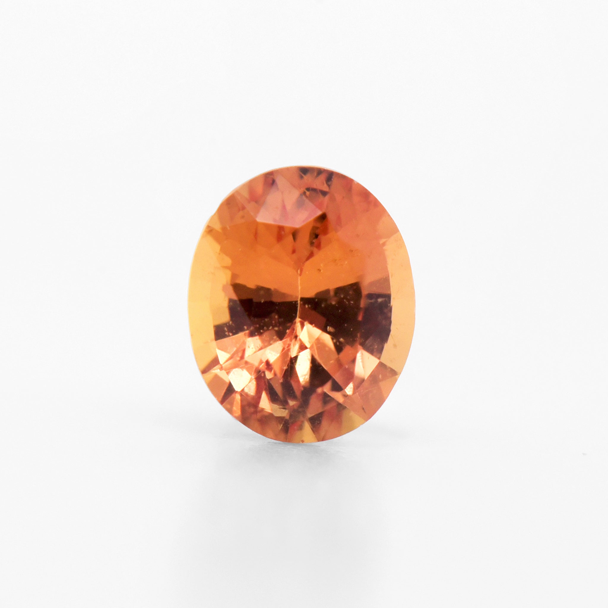 0.61cts 5.5x4.5mm Oval Faceted Orange Sapphire