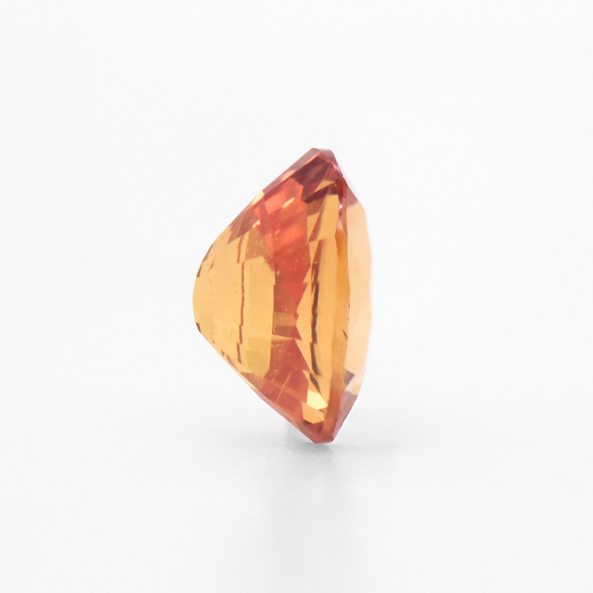 0.61cts 5.5x4.5mm Oval Faceted Orange Sapphire