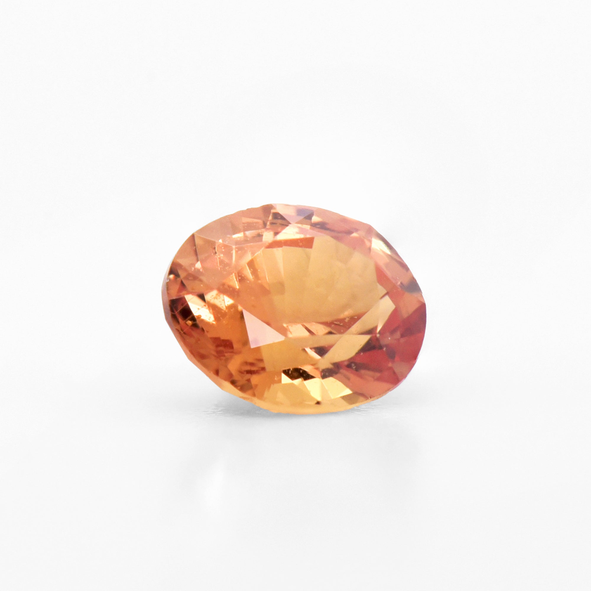 0.61cts 5.5x4.5mm Oval Faceted Orange Sapphire
